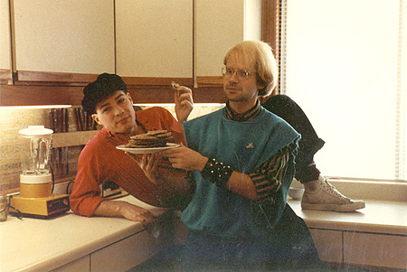 Danny on the kitchen counter eating cookies with David Vereschagin.
