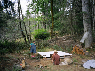 Chris Bearchell, Konnie Reich, David Duggan and Mel build a tent platform at Camp Swampy, summer 2005.