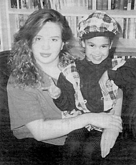 Lisa Neve, seen here with unidentified youngster, is no longer a 'dangerous offender.'