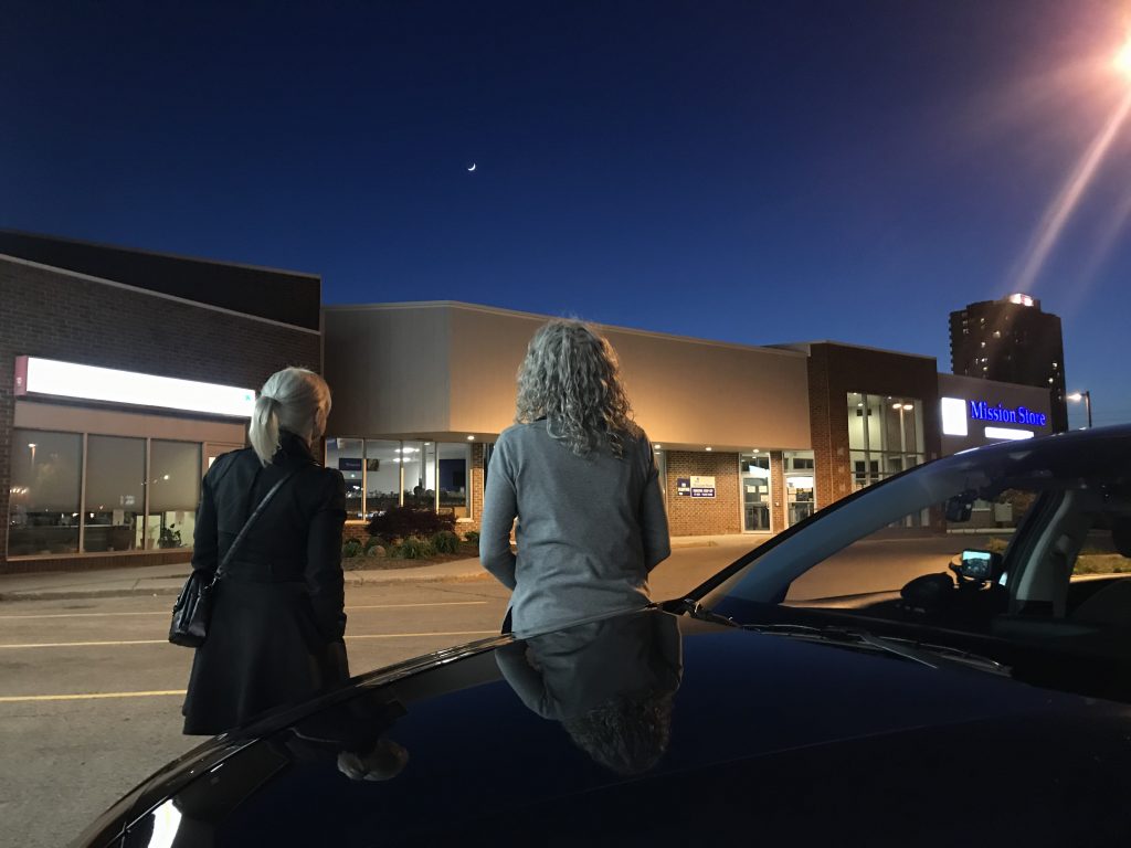 Negan Walker and Cristina Howorun look at the night sky before heading out on a John stake out. Credit: Tara Hughes