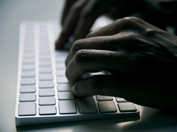 A person types on a computer keyboard in this stock photo. FILE PHOTO: Getty Images