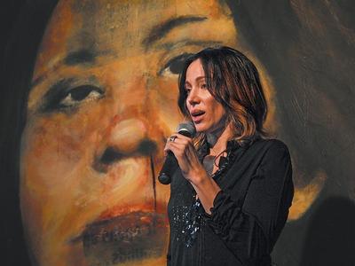 Vancouver artist Pamela Masik in Gastown yesterday, at the unveiling of Mona -- the first of 69 paintings she created depicting missing Downtown Eastside women. Mona will be on display at the new Terminus building on Water Street. KRISTEN THOMPSON, METRO VANCOUVER