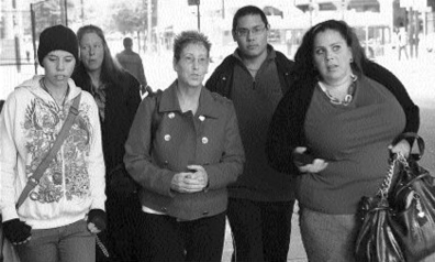 Lynn Frey (centre), stepmother of victim Marnie Frey, leaves court. PHOTO: Glenn Baglo, Vancouver Sun files.