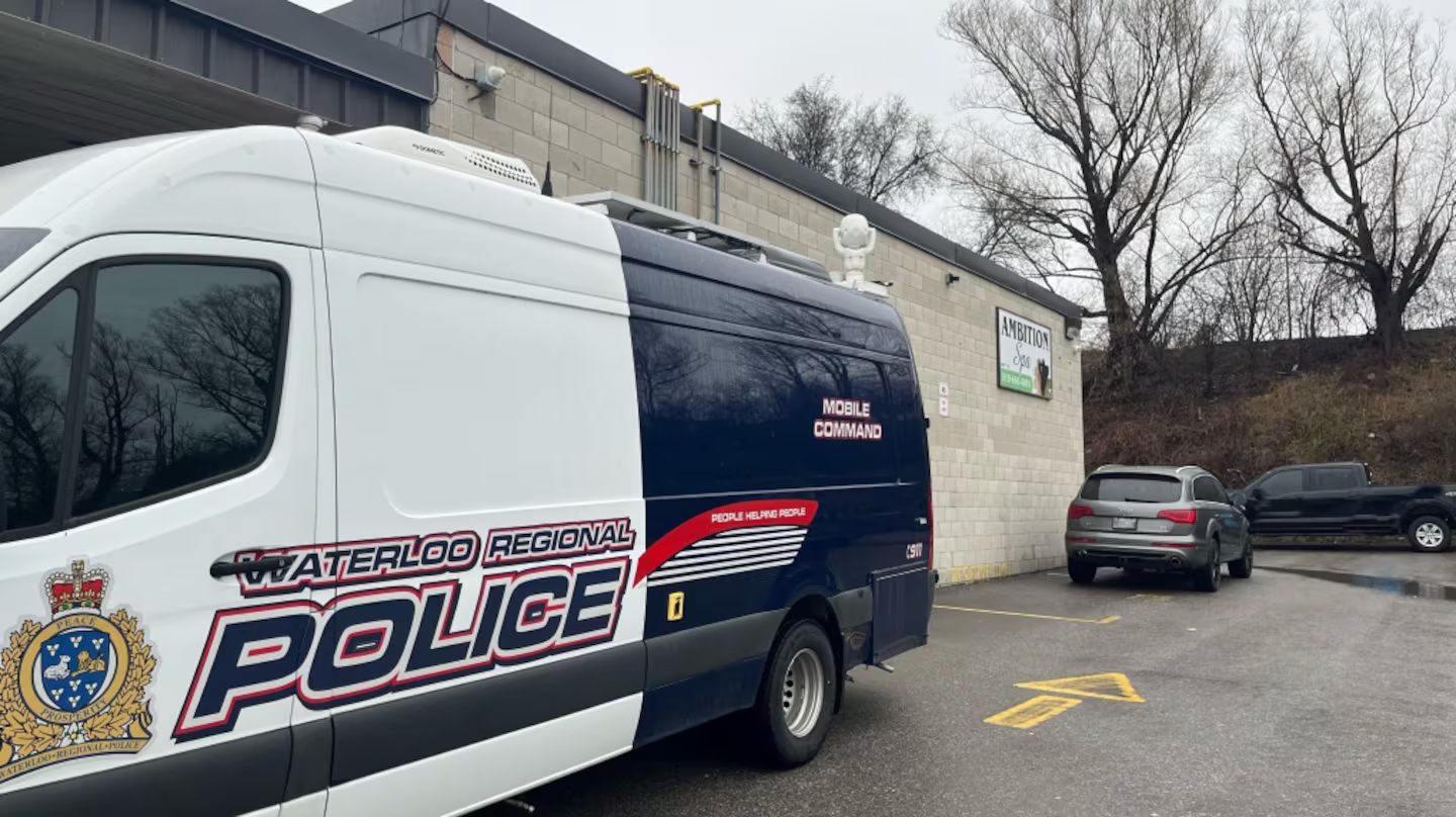Police are seen outside a business in Cambridge where police believe human trafficking occurred. (Stefanie Davis/CTV Kitchener)