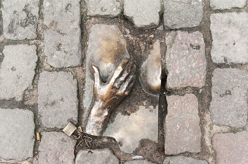 Bronze relief, Oudekerksplein Amsterdam. Photo credit: Stacey/Wikimedia