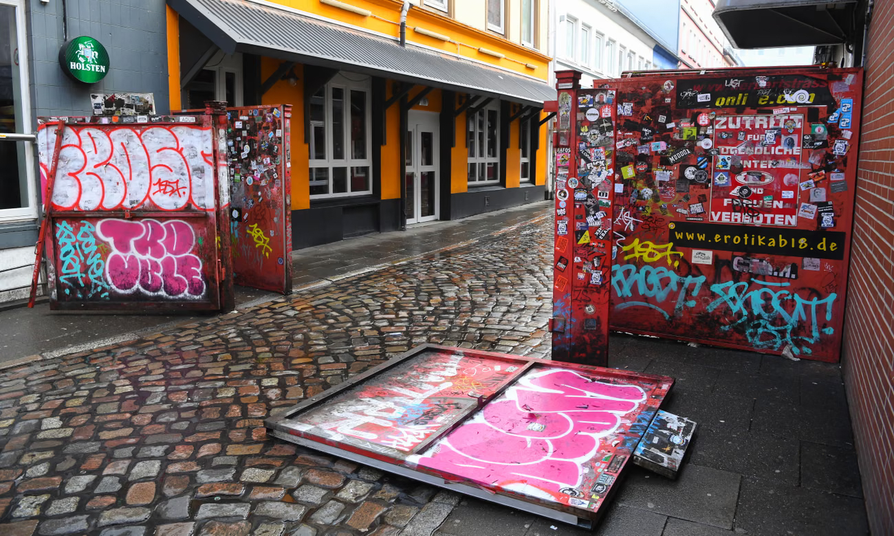 The metal gates at Herbertstra&szlig;e in Hamburg, affixed with signs barring women and under-18s, block out prying eyes and feature on countless Instagram feeds. Photo: Patrik Stollarz/AFP/Getty Images
